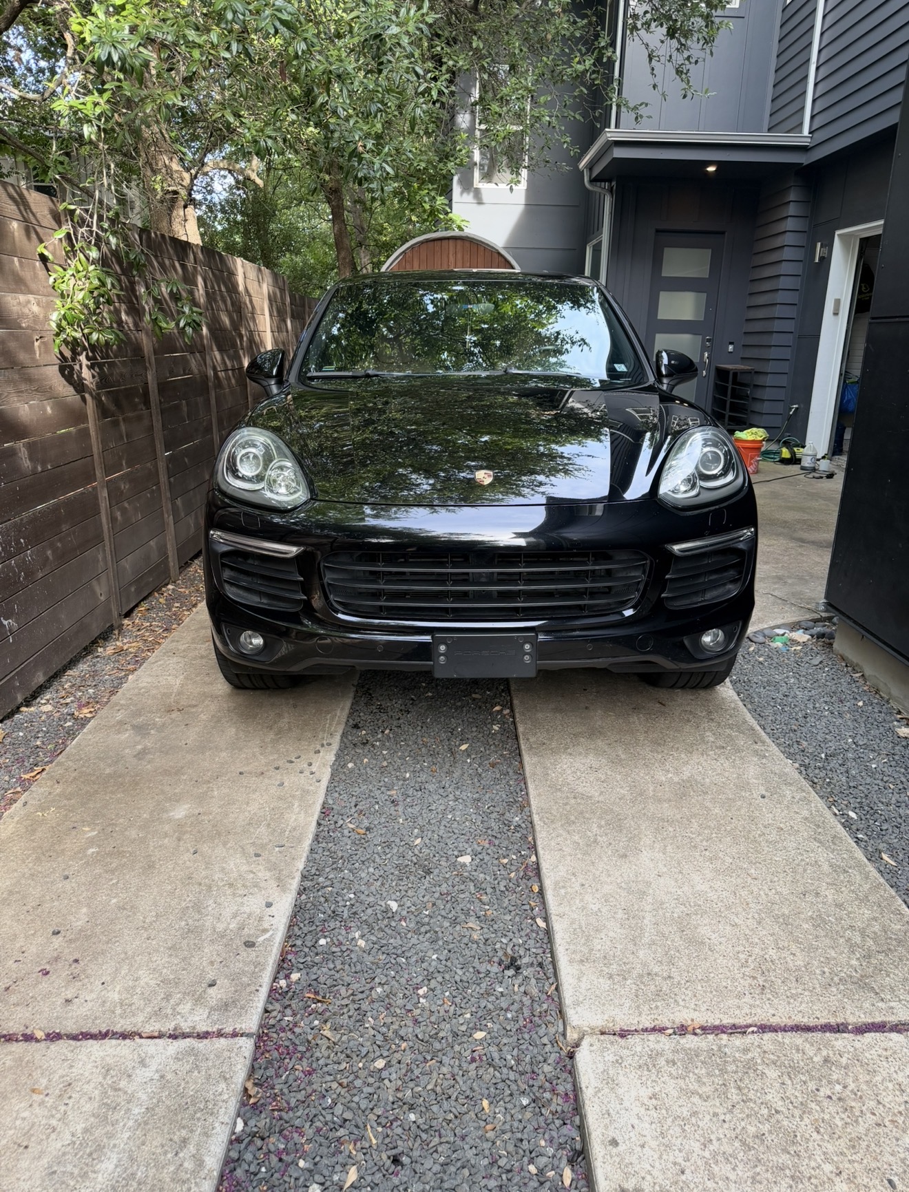Black Porsche Cayenne SUV after a full detail